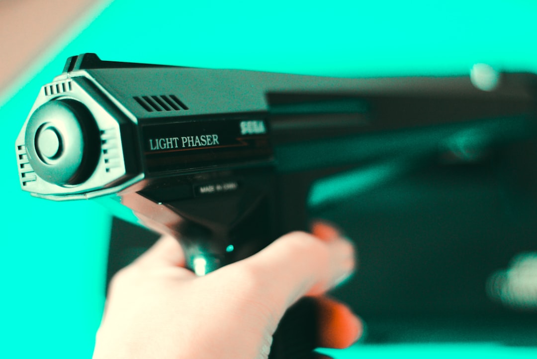 person holding black light phaser