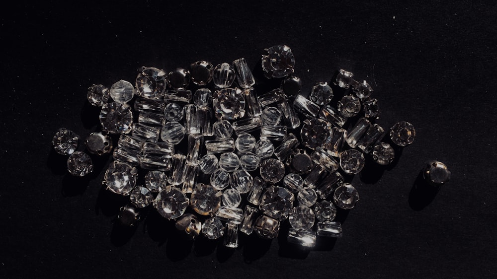 pile of clear stones on black surface