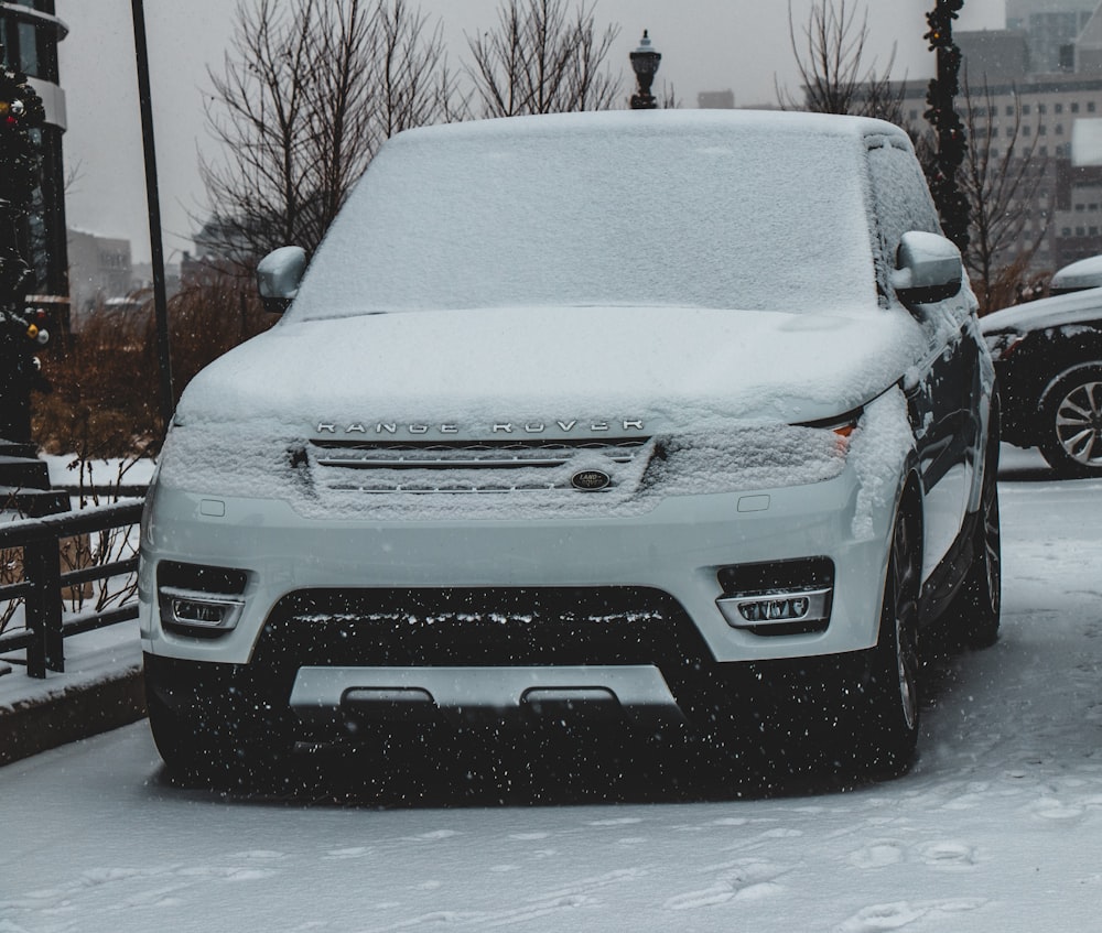 snow covered Land Rover Range Rover SUV