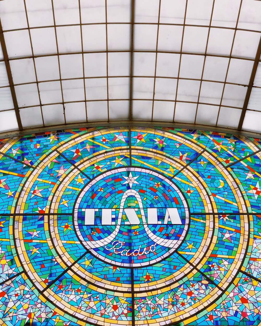 blue and yellow Tesla stained glass window