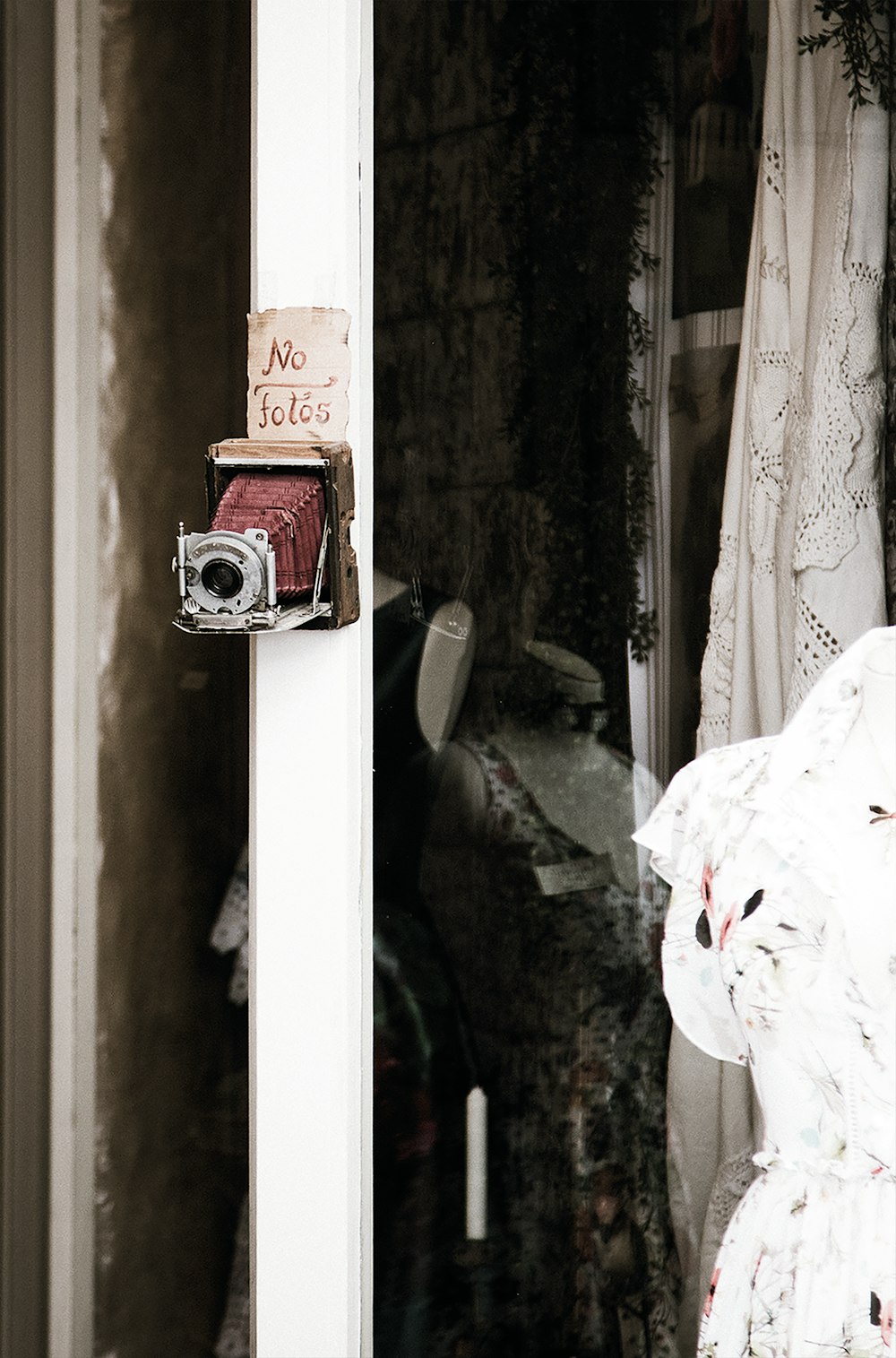 red and gray camera on wall