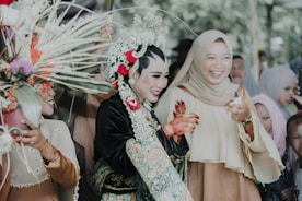 Guests enjoying a joyful celebration in a heritage courtyard.