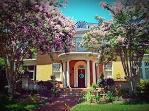 Before and after photo of a charming Memphis home restored with care.