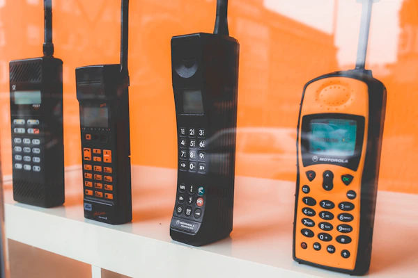 A gallery wall featuring various mobile phone models from classic to modern designs.