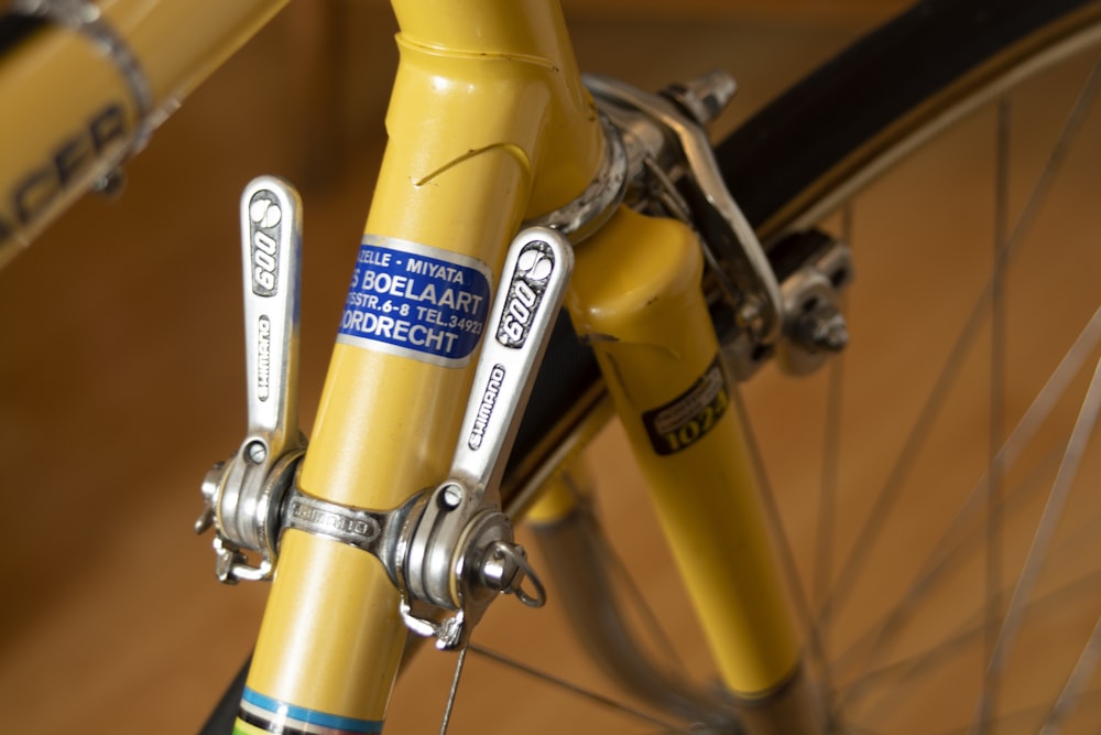 yellow and gray stainless steel bike