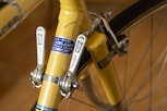 yellow and gray stainless steel bike