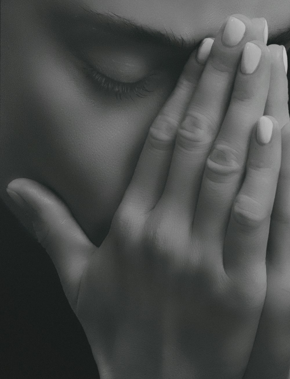 close up photo of person covering nose by its hand