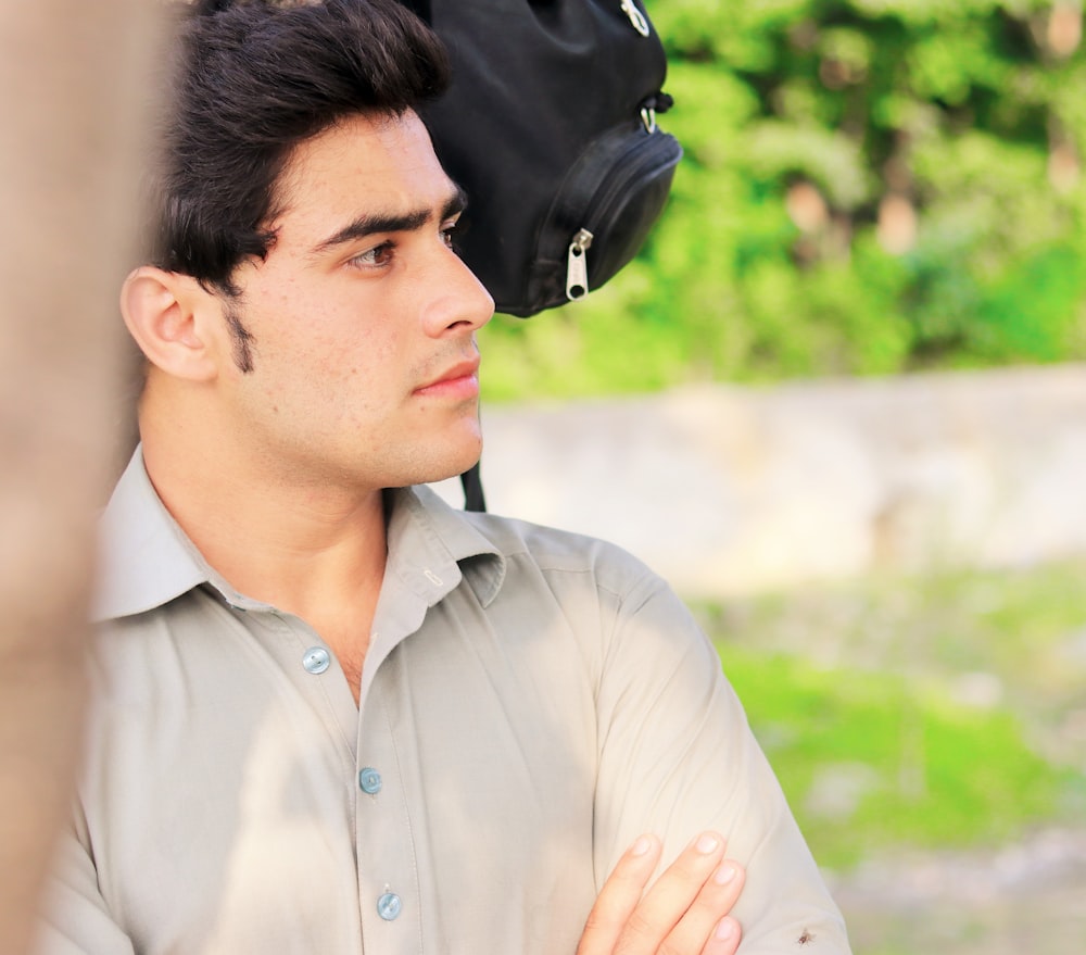 man in brown dress shirt in selective focus photography