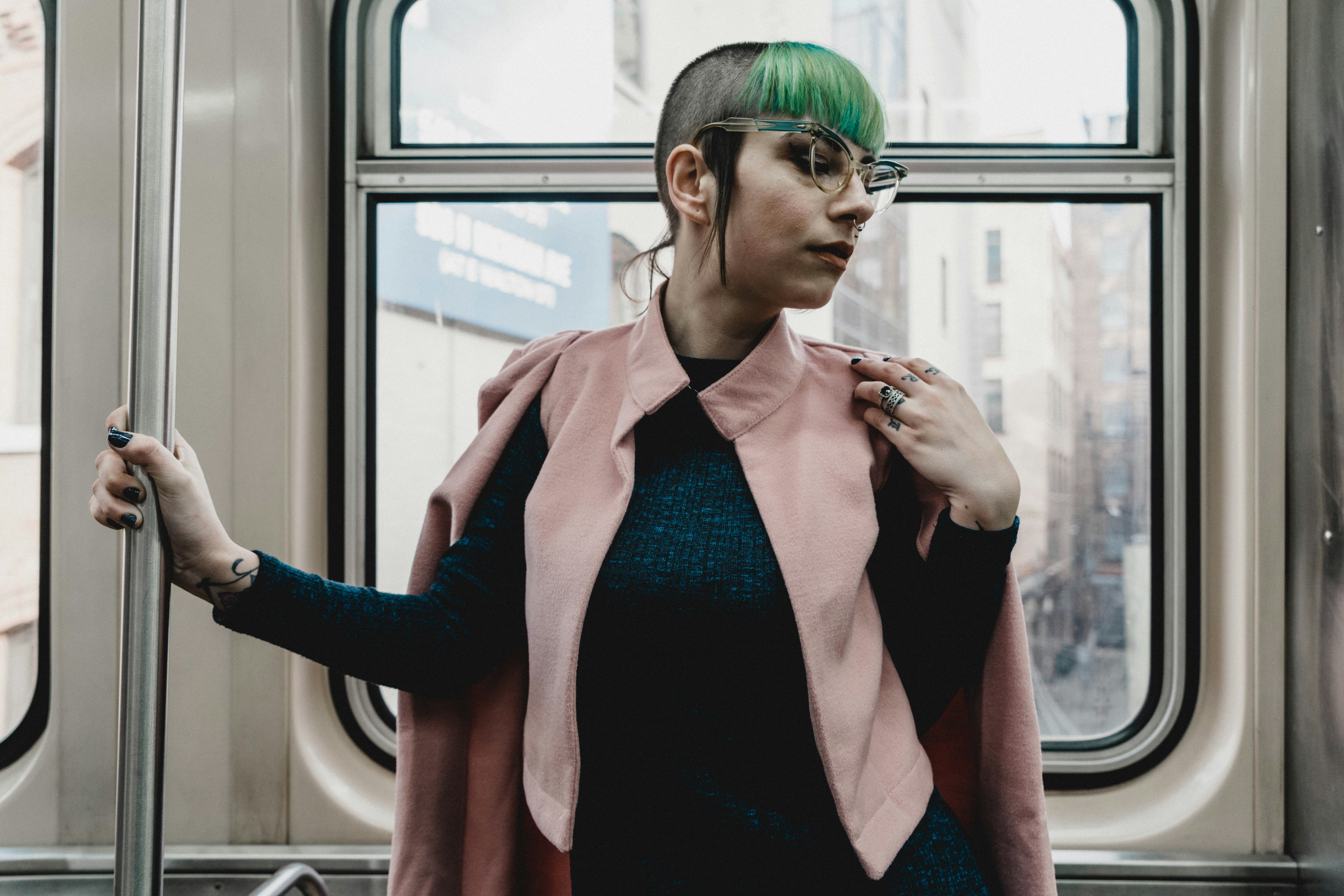 woman standing inside train on focus photography
