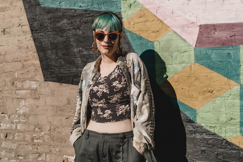 woman standing near graffiti wall