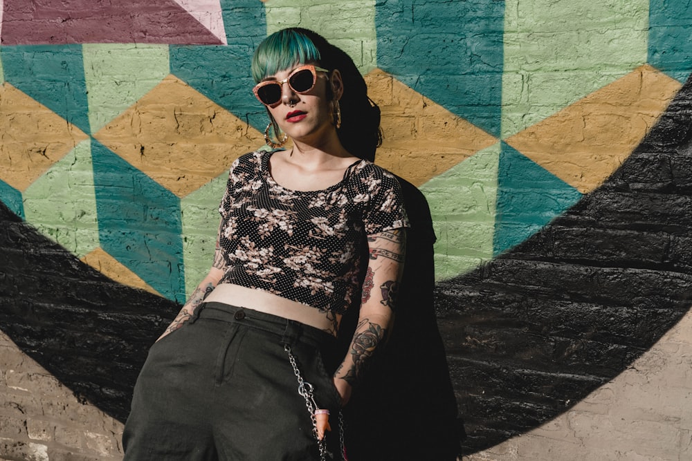 woman standing near graffiti wall