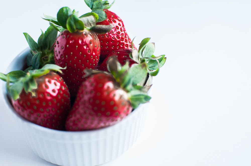 red strawberries in white ramekin