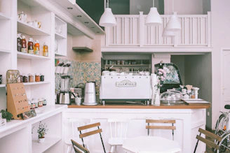 Elegant minicafe corner showcasing the compact espresso machine and accessories in a cozy setting