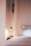 A serene bedroom with soft lighting and calming decor, promoting relaxation and sleep.