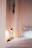 A serene bedroom with soft lighting and calming decor, promoting relaxation and sleep.
