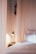 A cozy bedroom adorned with stylish pleated curtains in calming colors.