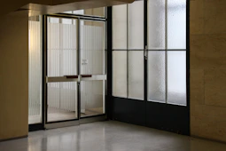 closed gray stainless steel framed glass door