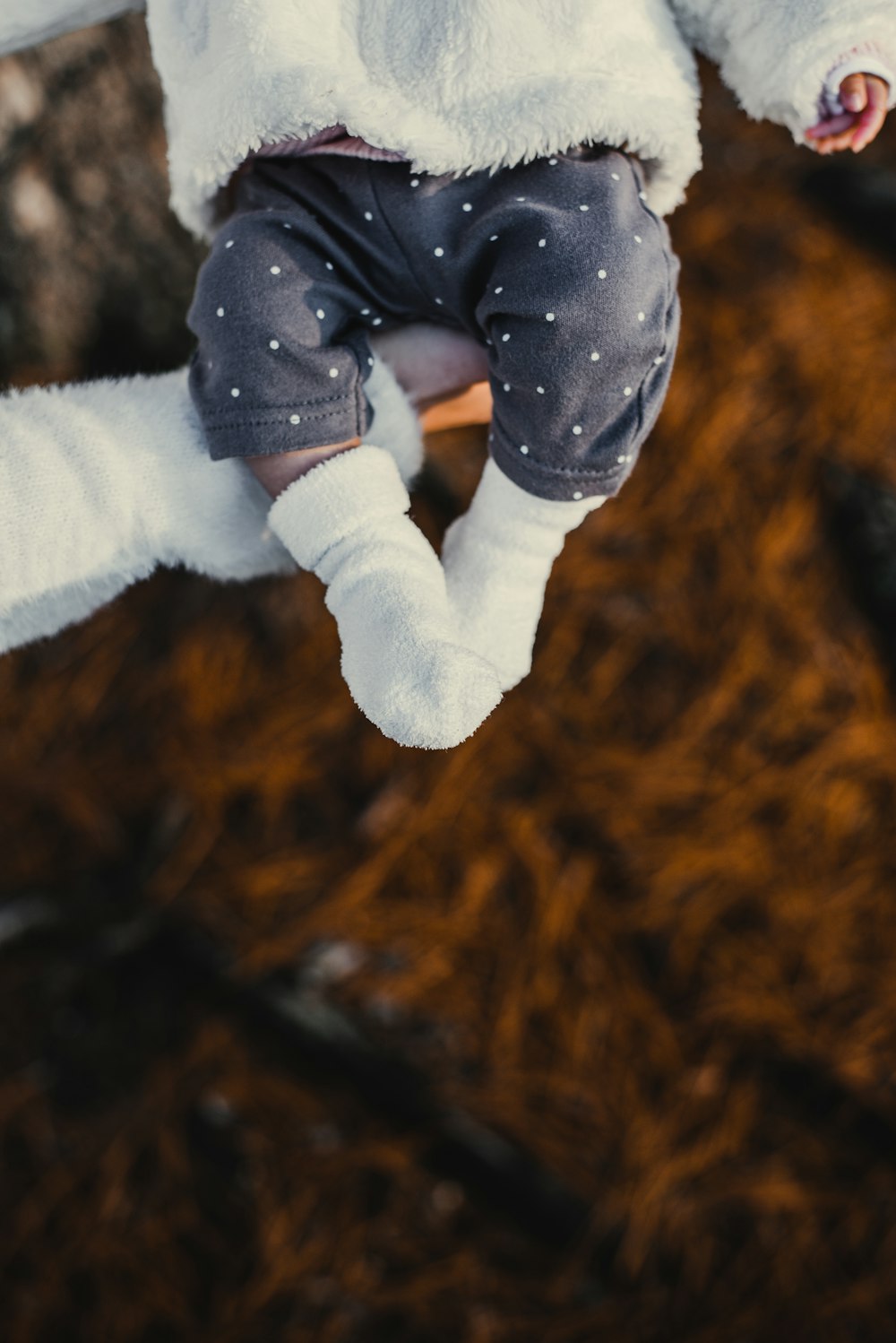 person carrying baby close-up photo