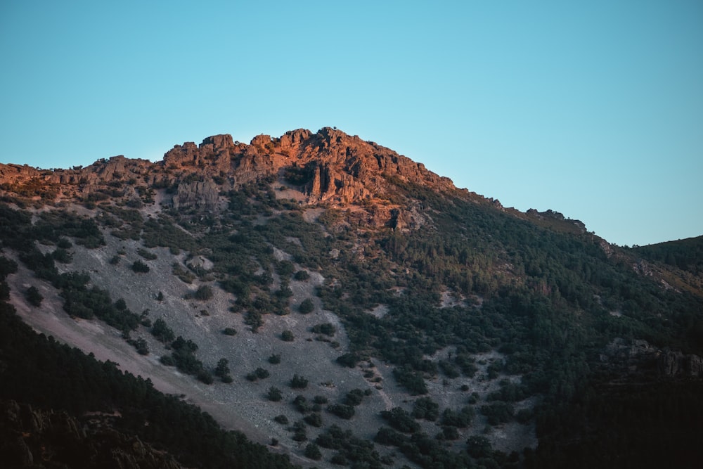 brown mountain under blue sky