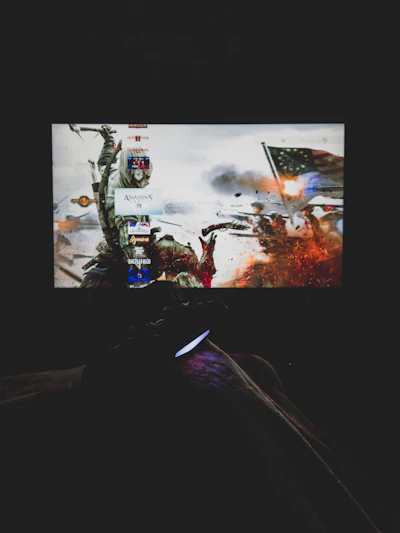 A dynamic scene showing a gamer excitedly playing a PS4 game on a large screen.