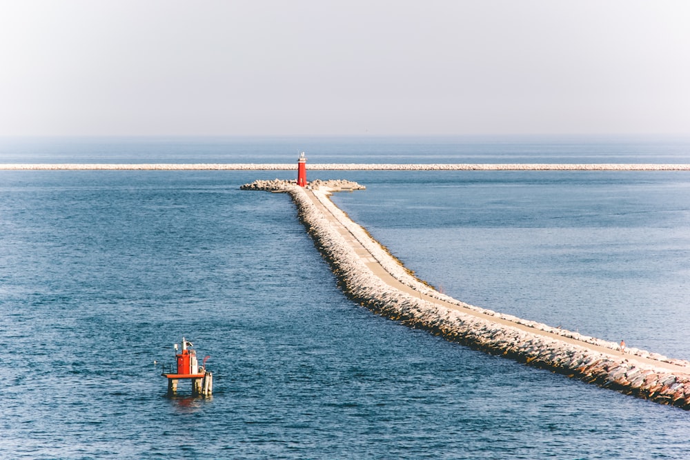 gray pathway at middle of sea