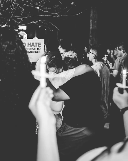 A symbolic image of a candlelight vigil representing hope and resistance for democracy.