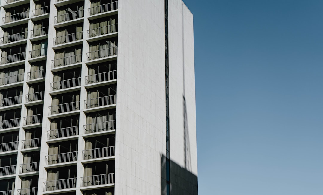 gray high rise building under white sky,