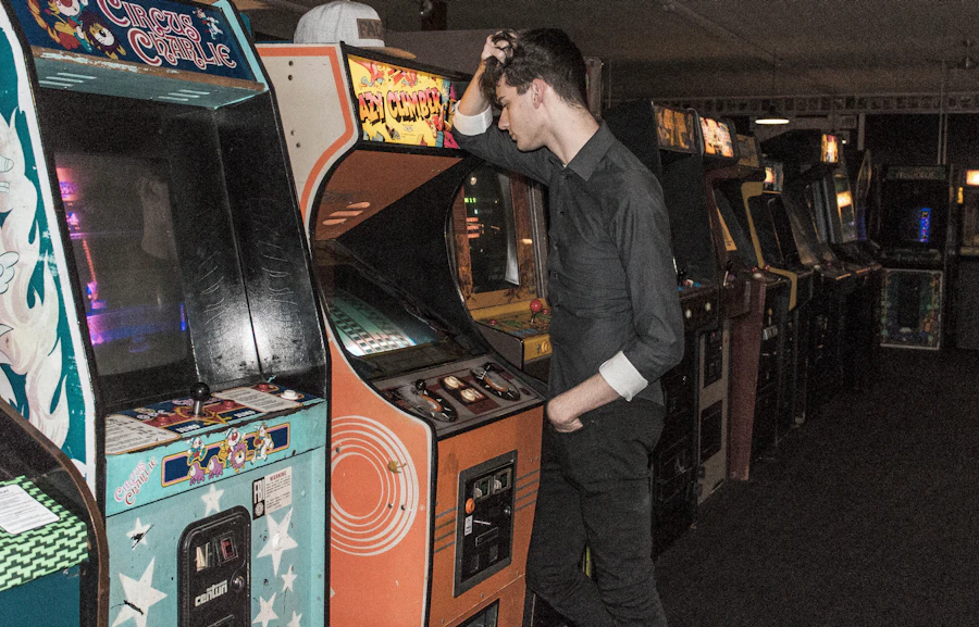 Person working on a restored arcade machine