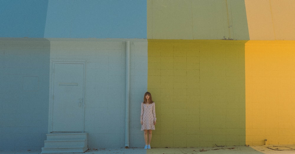 woman standing against the wall