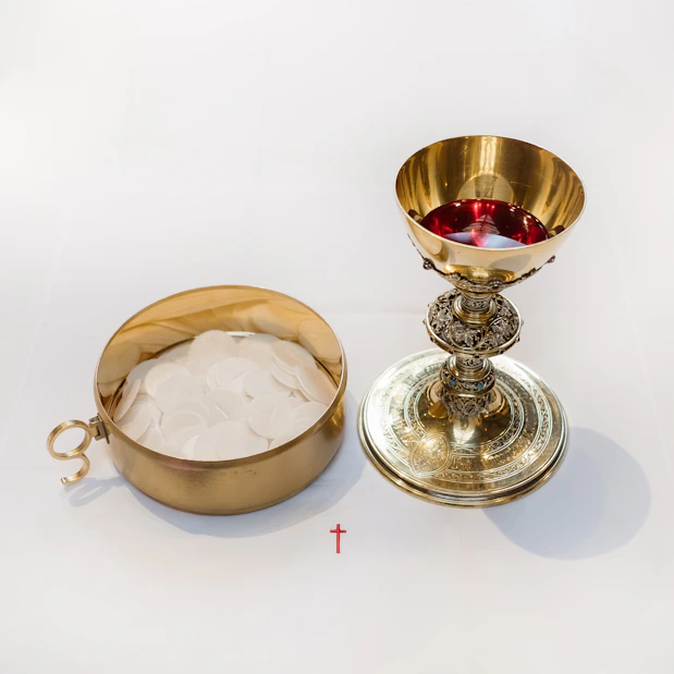 a gold chalice and a bowl of ice