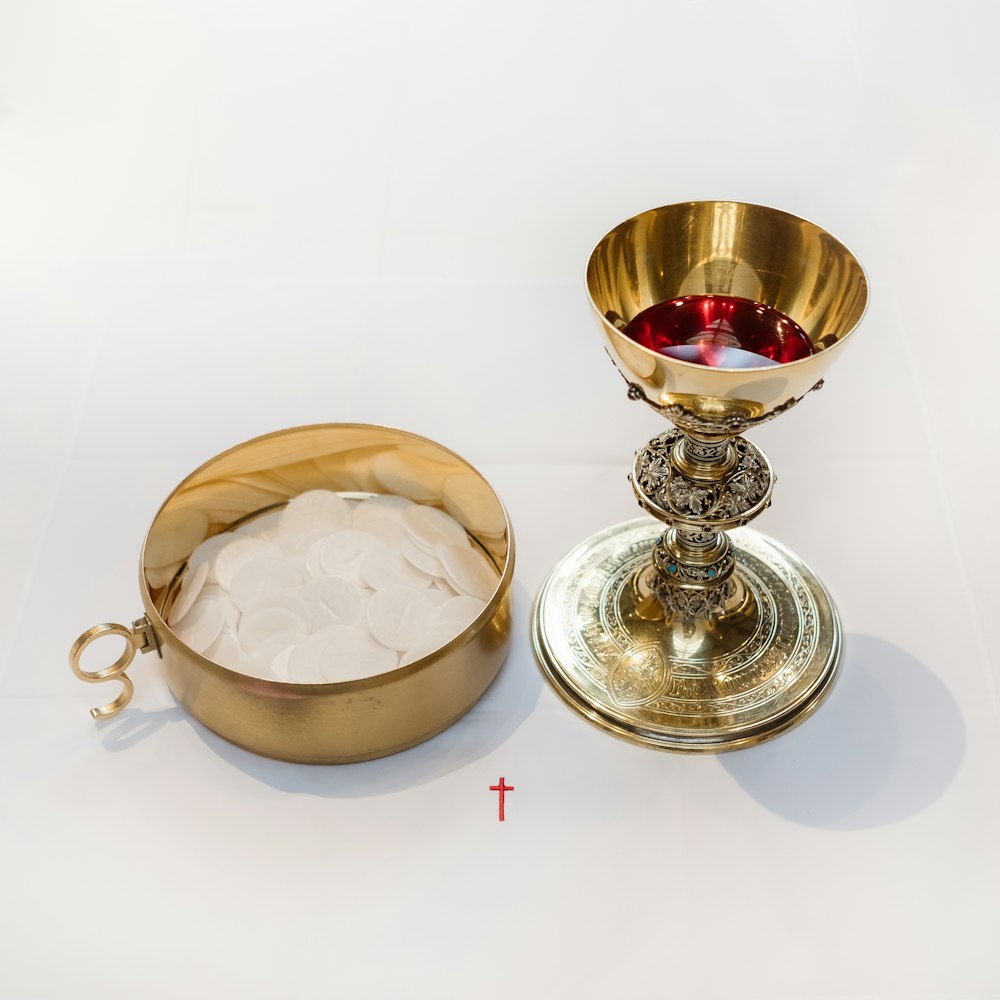a gold chalice and a bowl of ice