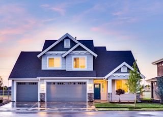 blue and gray 2-storey house under sky