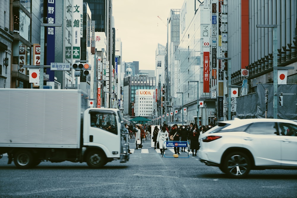 people walk in road with Japan flag in building