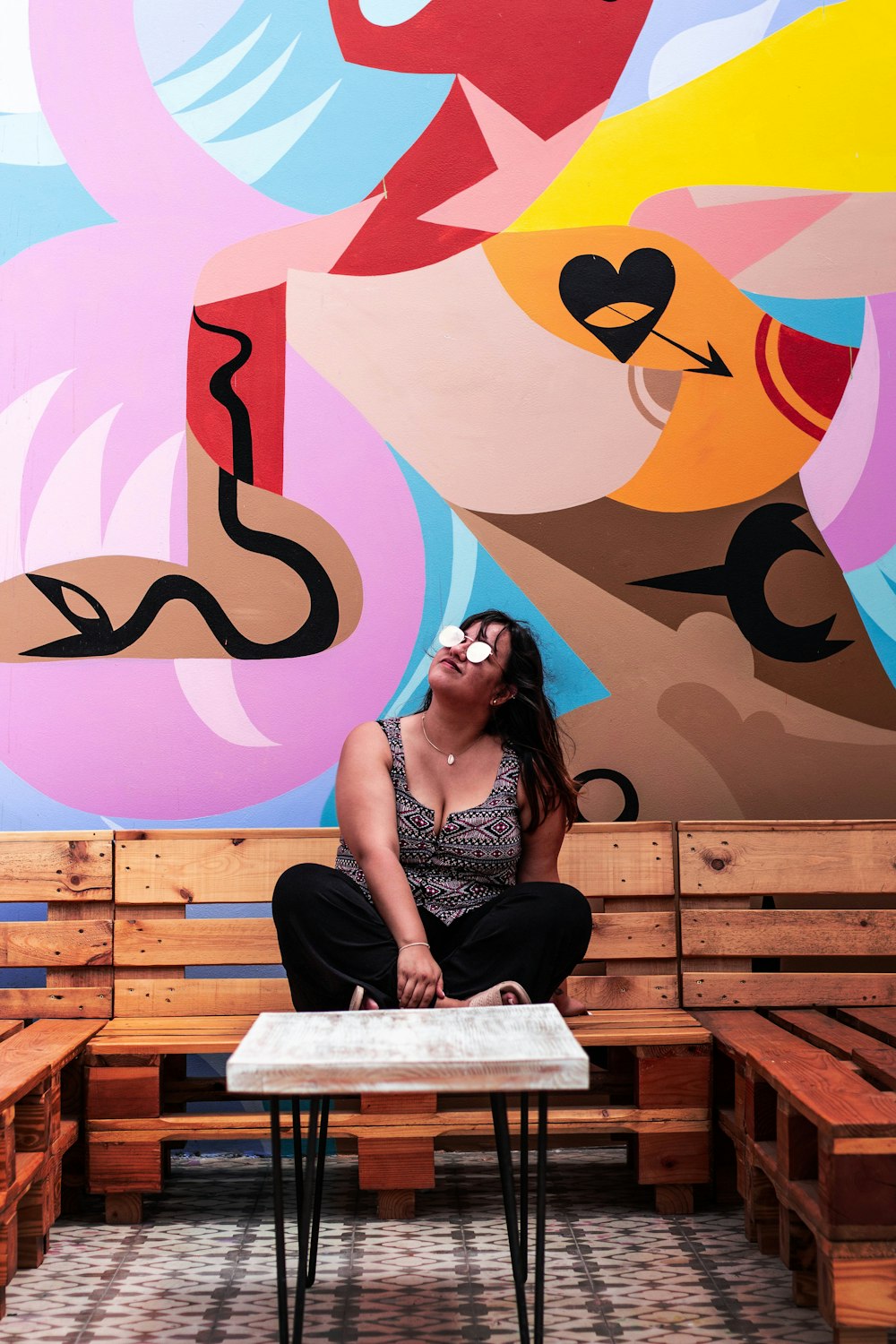 woman sitting on brown wooden chair