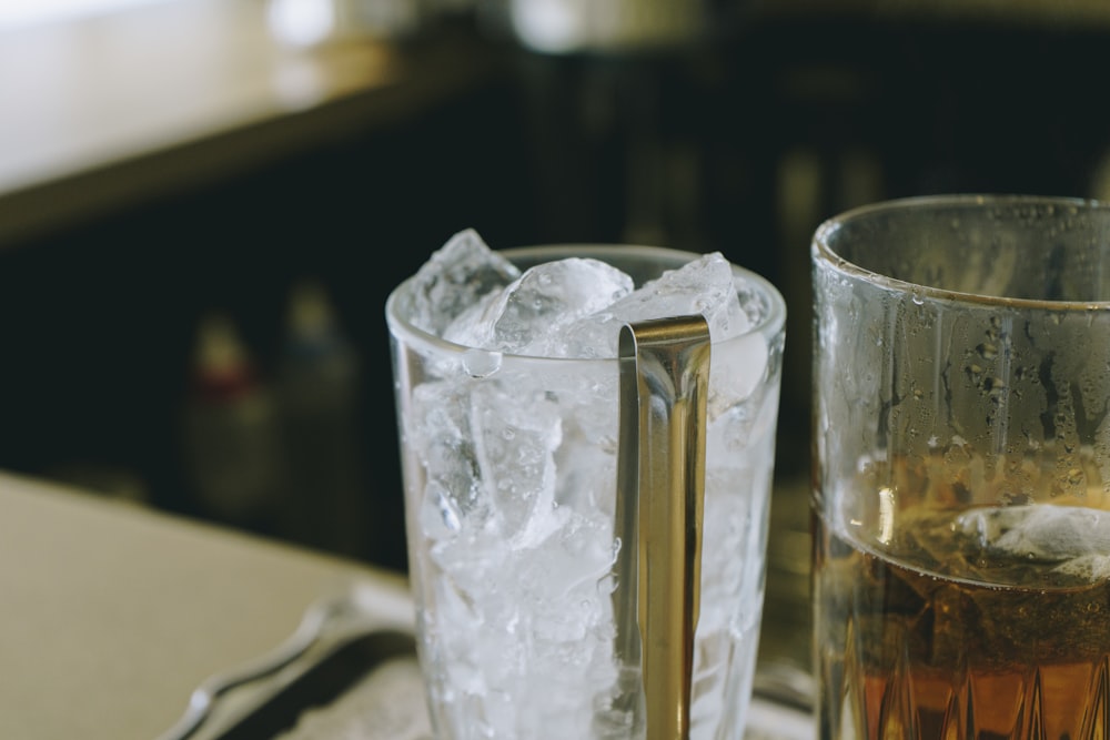 clear drinking glass with ice cubes