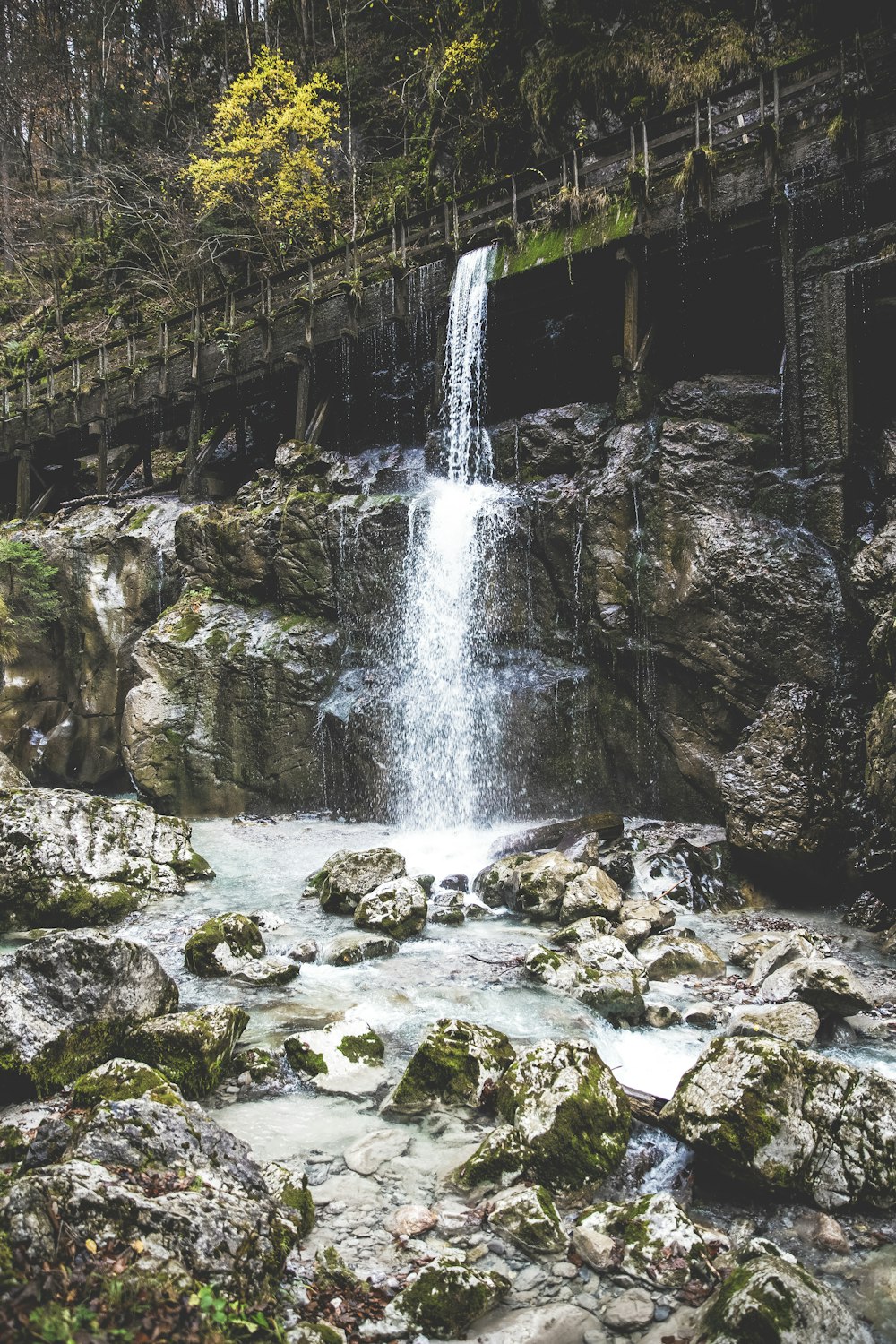 flowing water under bridge