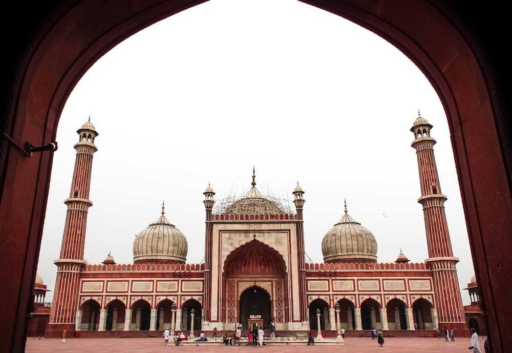 low-angle photography of maroon and gray mosque during daytime