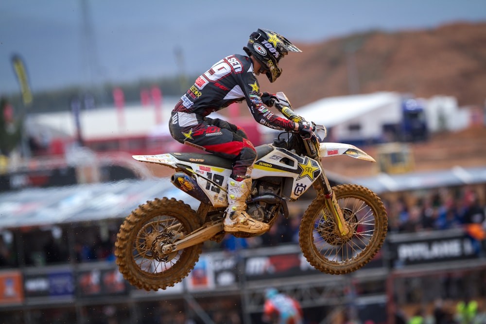 man riding dirt bike doing exhibition