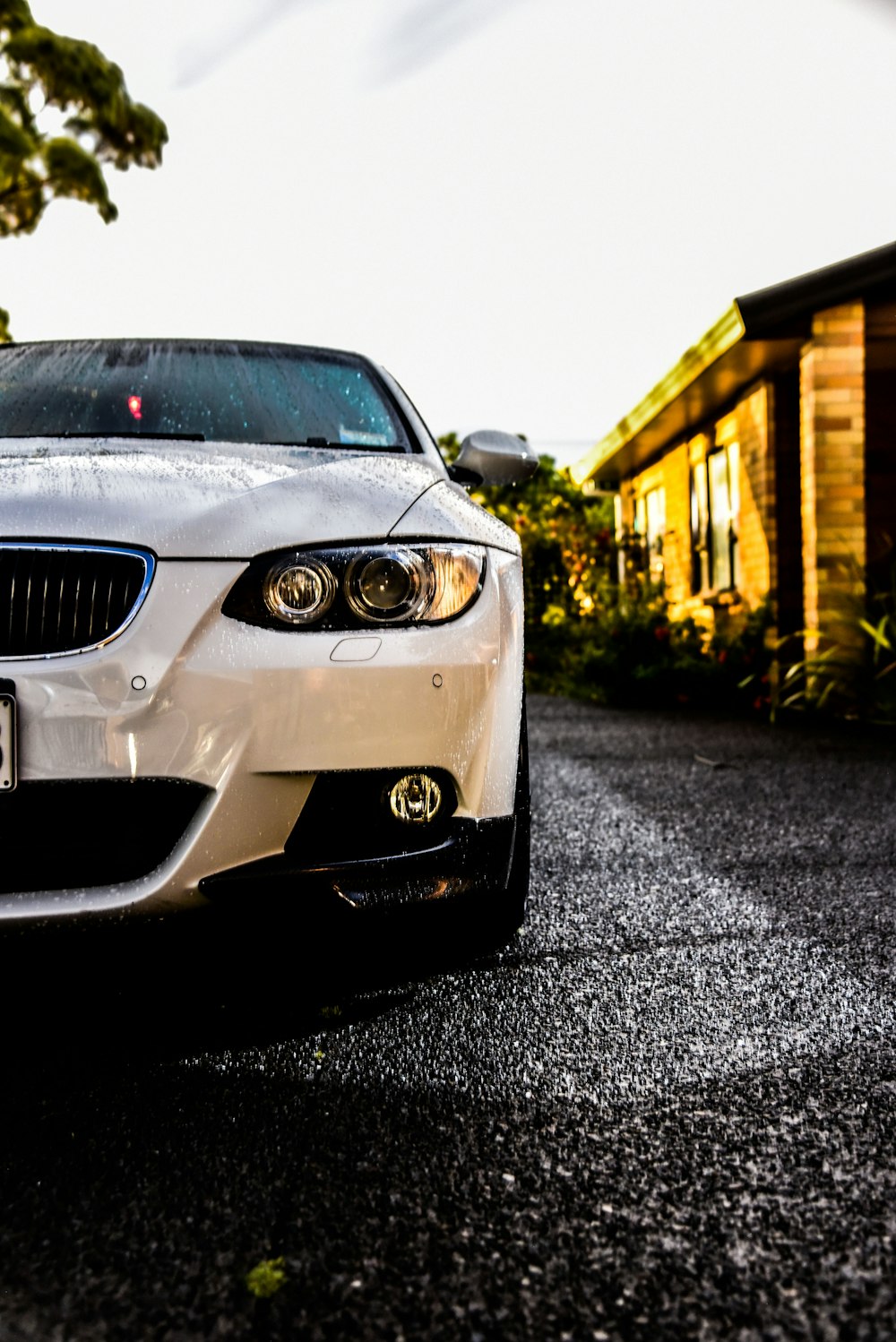 white vehicle parked near house