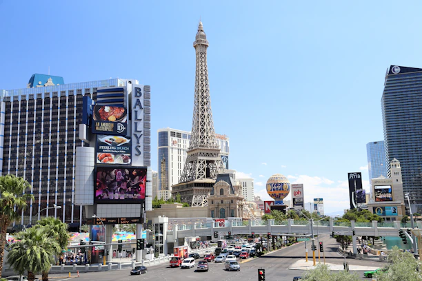 A vibrant collage showing hotels, luxury cruises, scenic trains, and exotic excursions bustling with travelers.