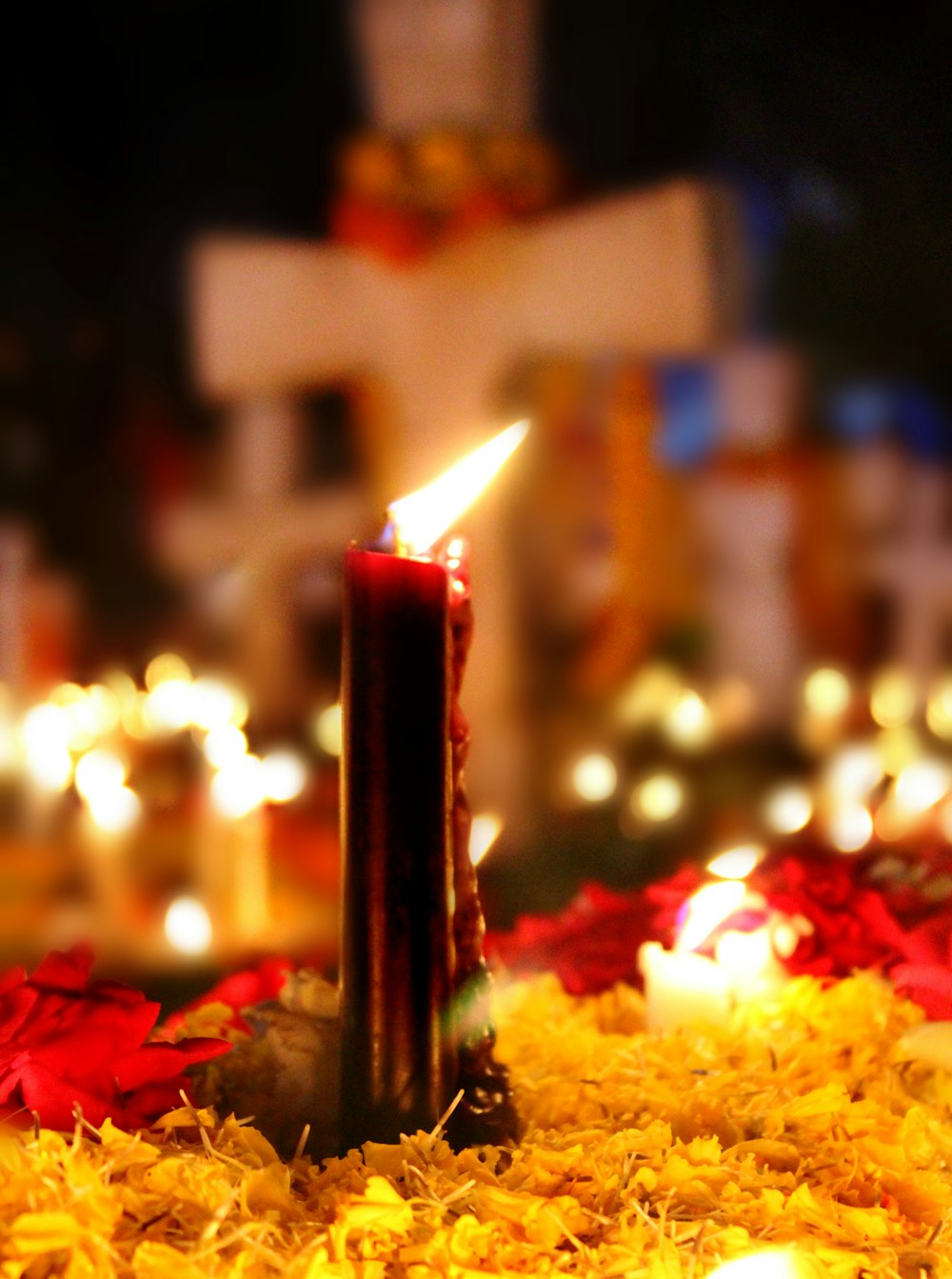 close-up photography of lighted red candle