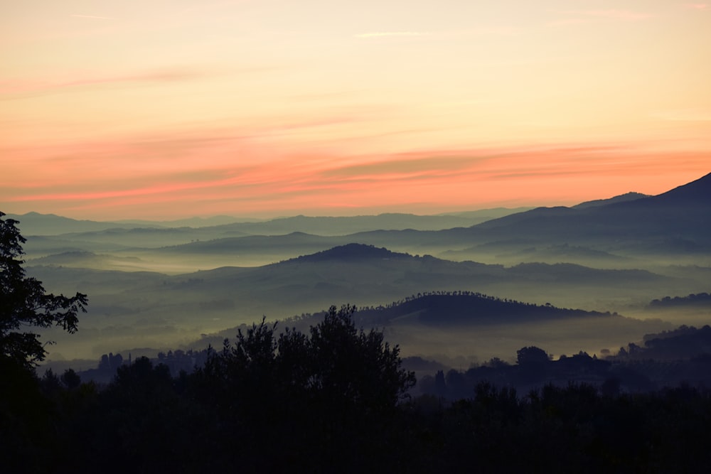 high-angle photography of mountains at golden h