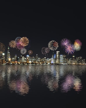 skyline buildings under fireworks display