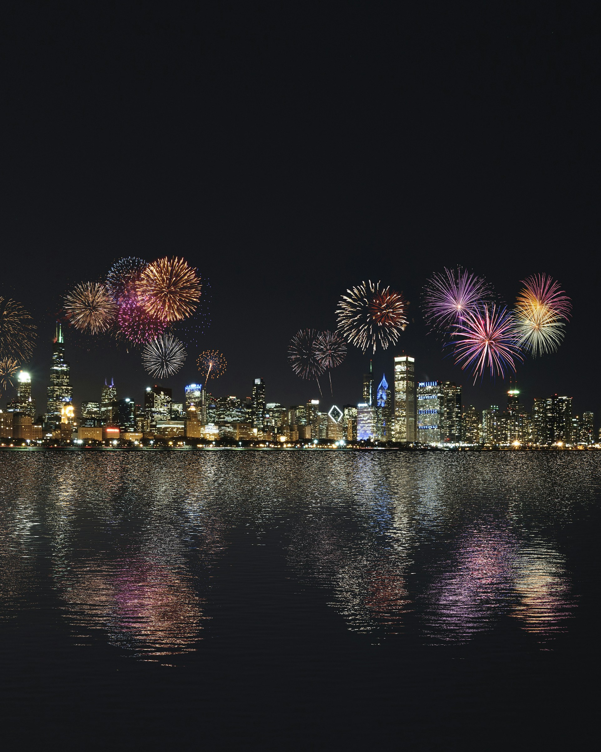 skyline buildings under fireworks display