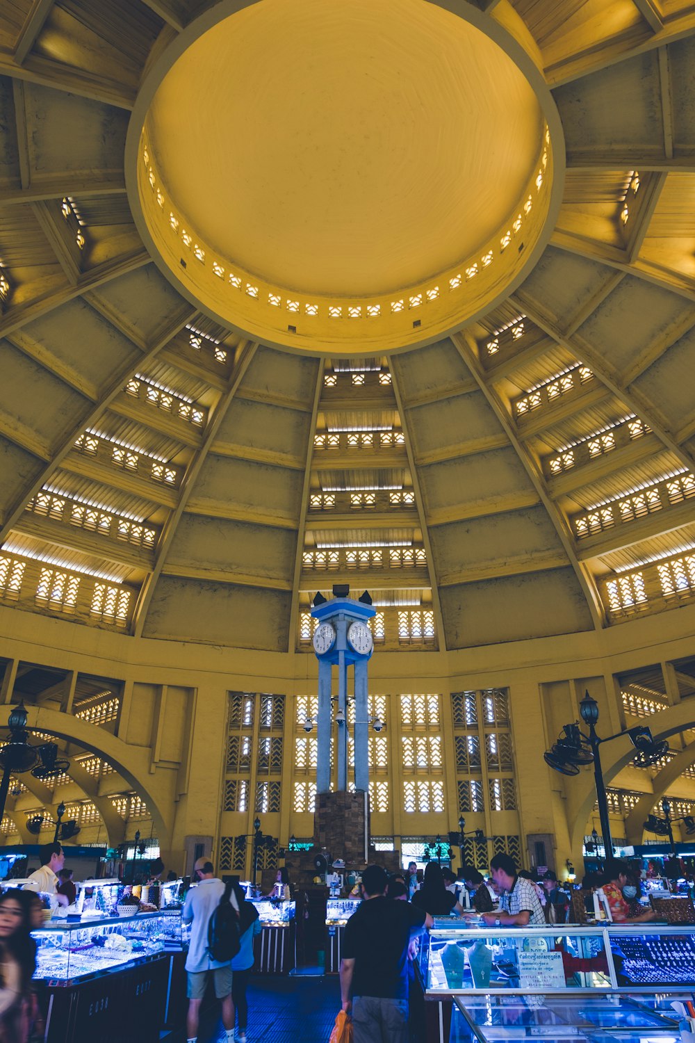 the ceiling of a large building with many windows