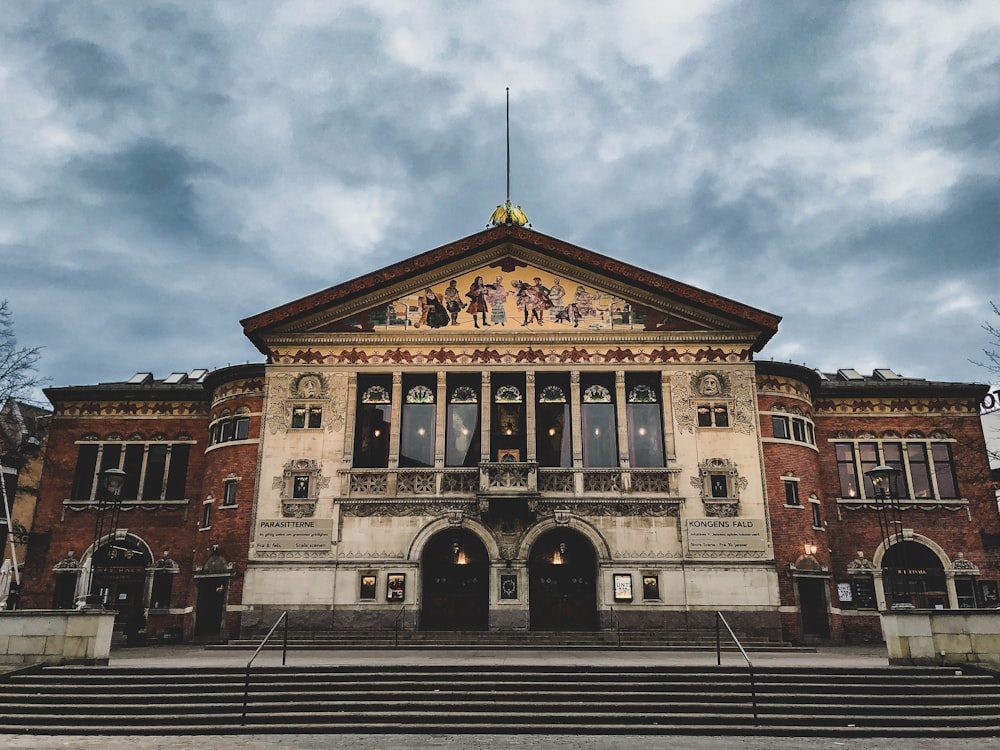 view of architectural building under cloudy sky