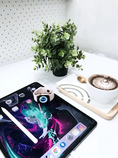 Digital downloadable art print showcased on a sleek tablet next to a cup of coffee.