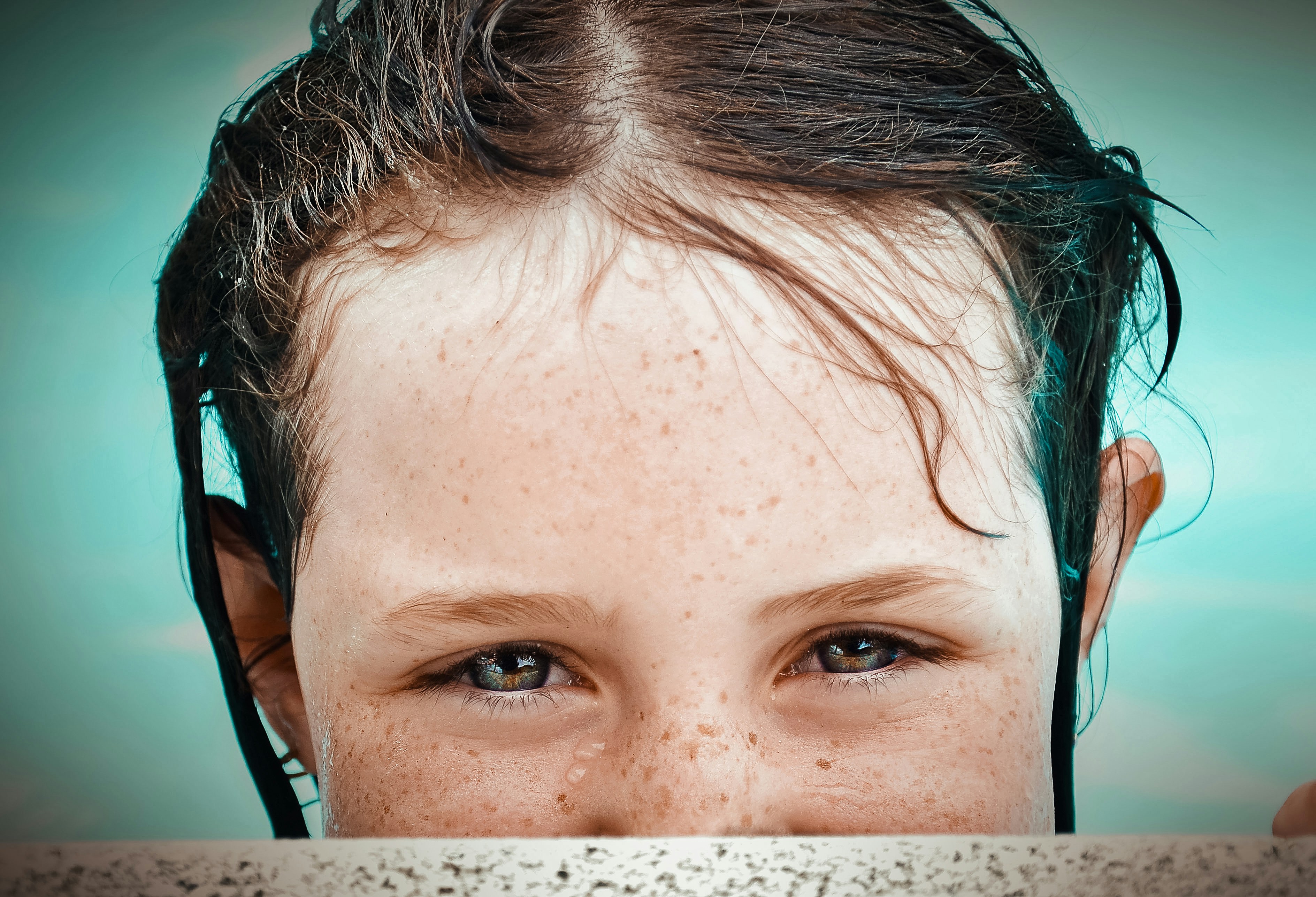 selective focus photography of girl at pool