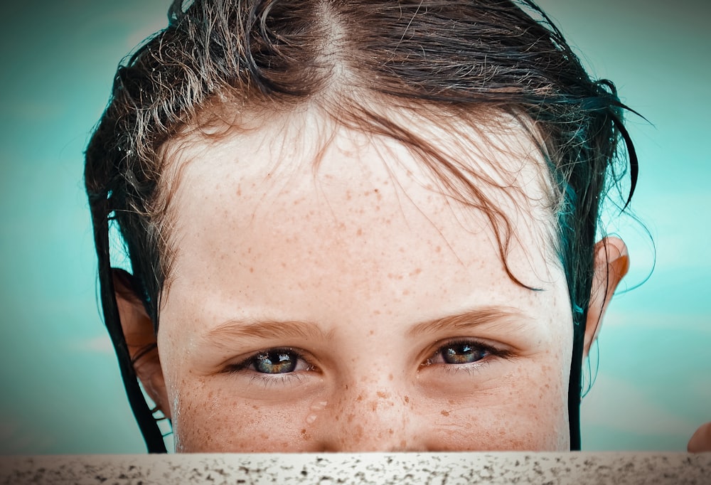 selective focus photography of girl at pool