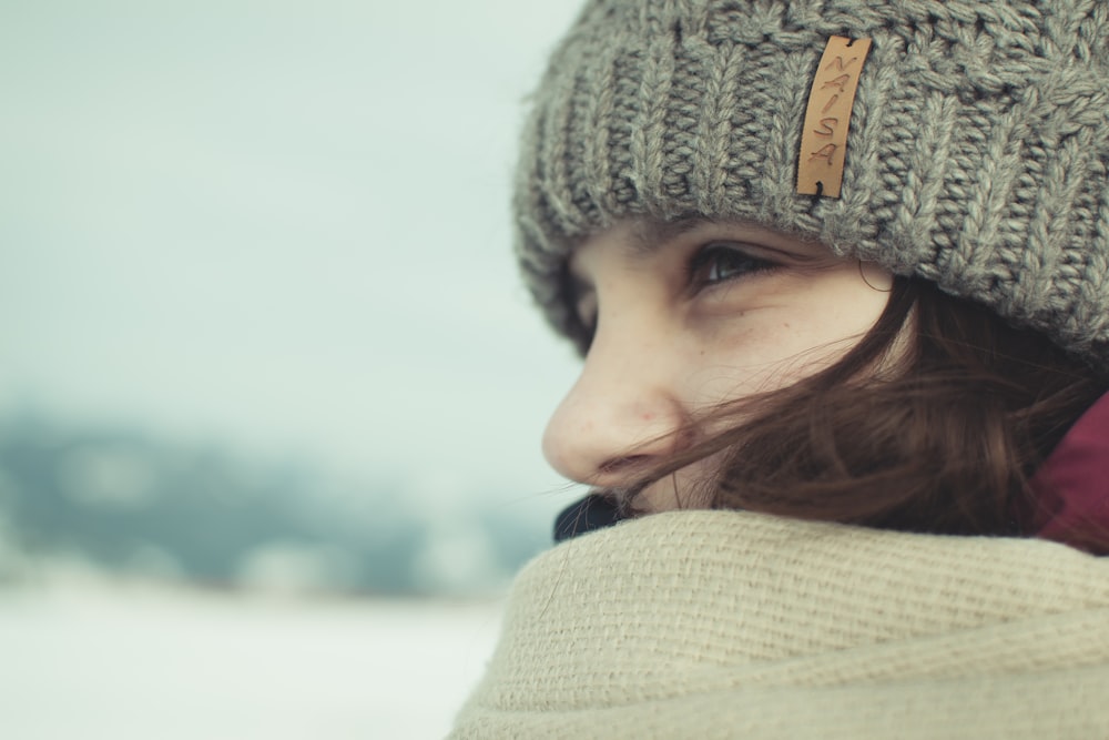 woman wearing gray knit cap